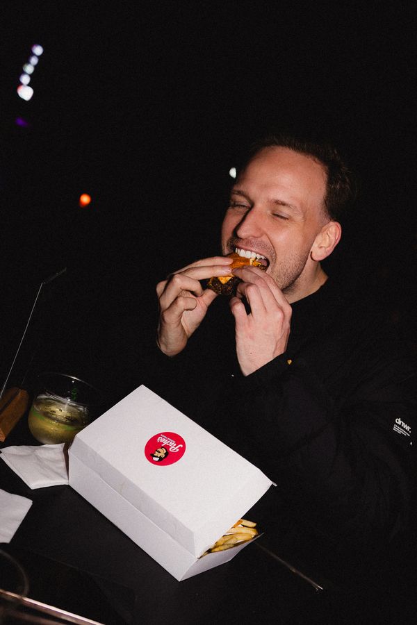 Biting into a Pacho's burger